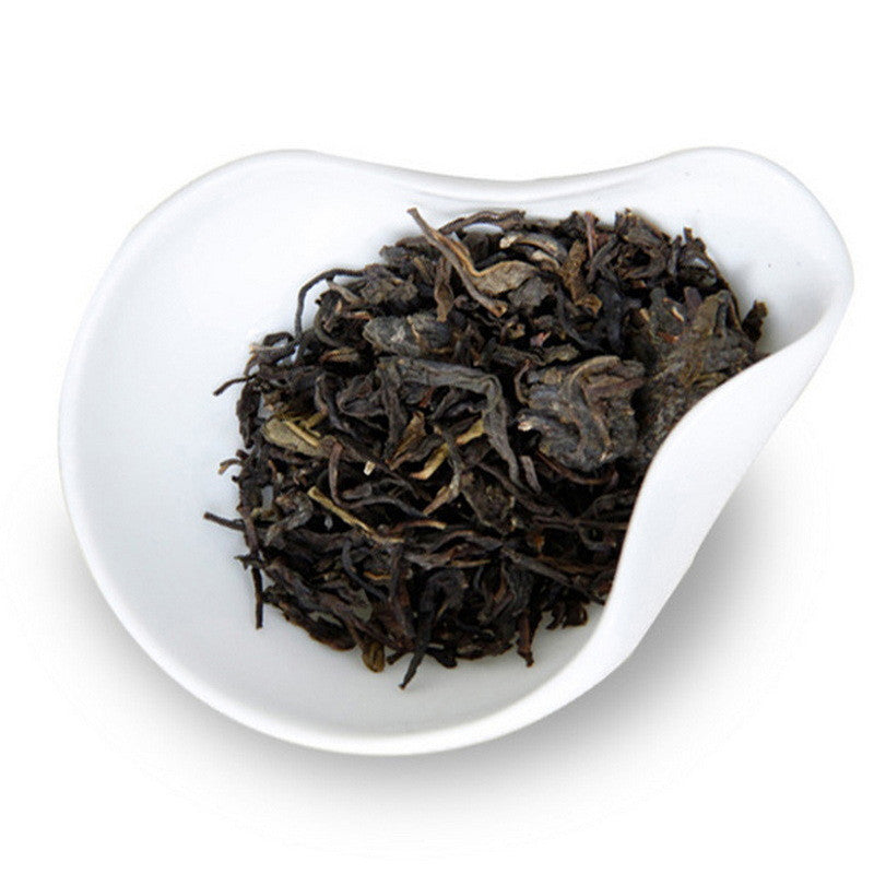 Dry leaves of Jing Dian 7542 Sheng Pu-erh by Dayi