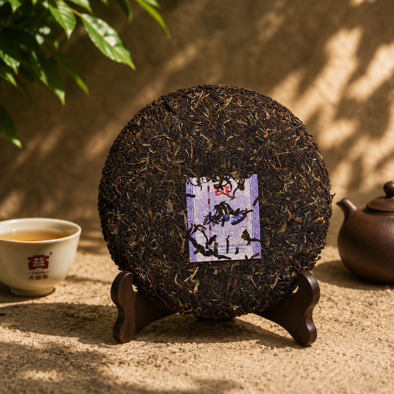 Broken piece of Mi Xiang raw pu-erh cake showing pressed leaves