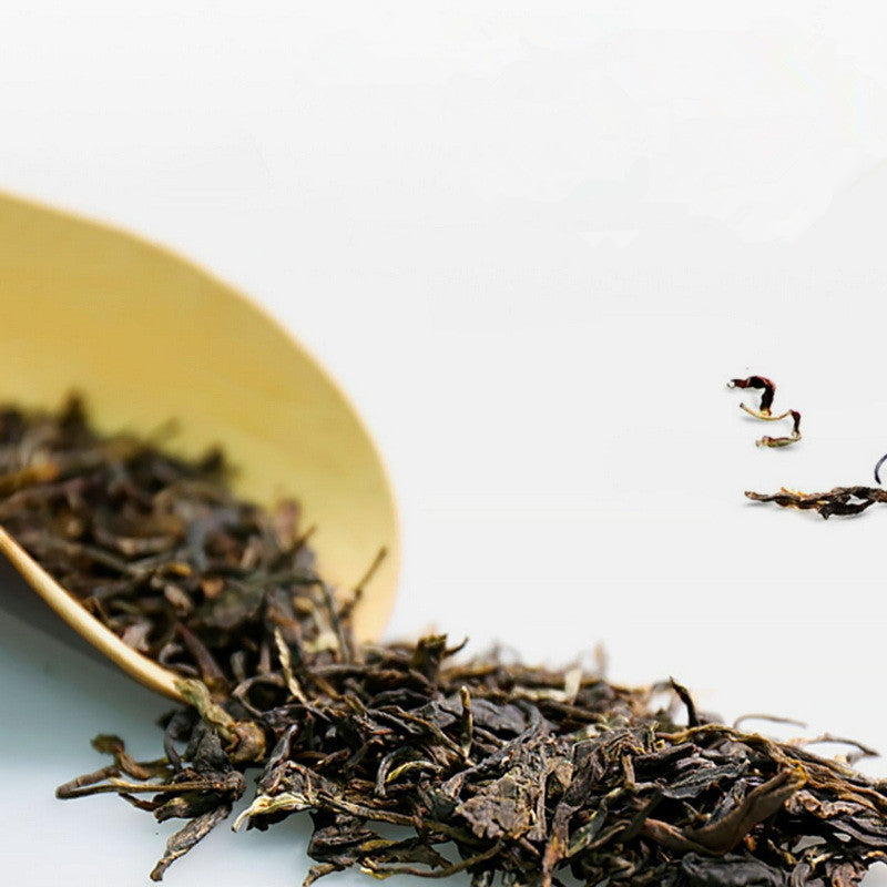 Dry leaves of Wang Cai Yuan Bao Sheng Pu-erh by Dayi